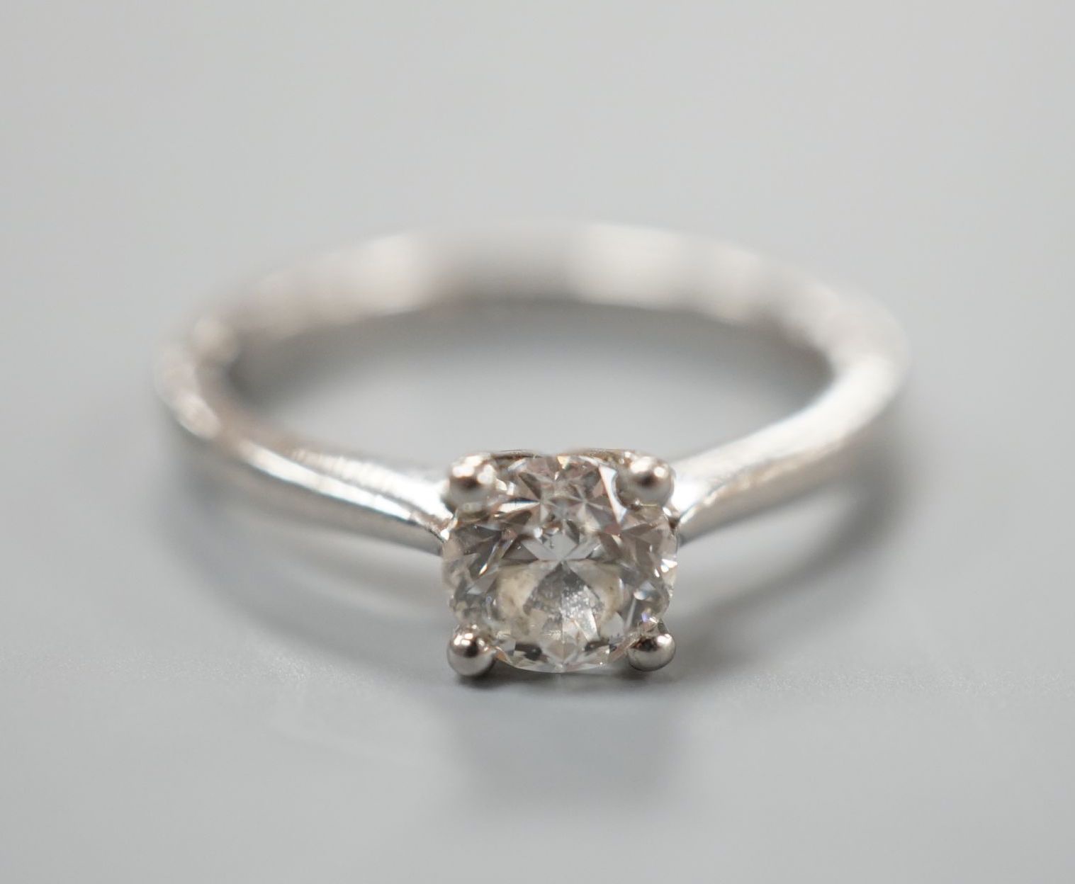 A modern platinum and solitaire diamond ring, size K, gross weight 3.6 grams